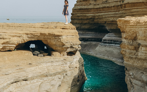 A Woman Standing on a Cliff in Sidari, Corfu from Chrome web store to be run with OffiDocs Chromium online A Woman Standing on a Cliff in Sidari, Corfu from Chrome web store to be run with OffiDocs Chromium online
