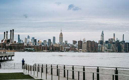 Man standing on embankment of river in big city from Chrome web store to be run with OffiDocs Chromium online Man standing on embankment of river in big city from Chrome web store to be run with OffiDocs Chromium online